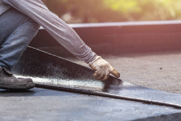 Professional Basement Waterproofing technician working in Fairfax, VA